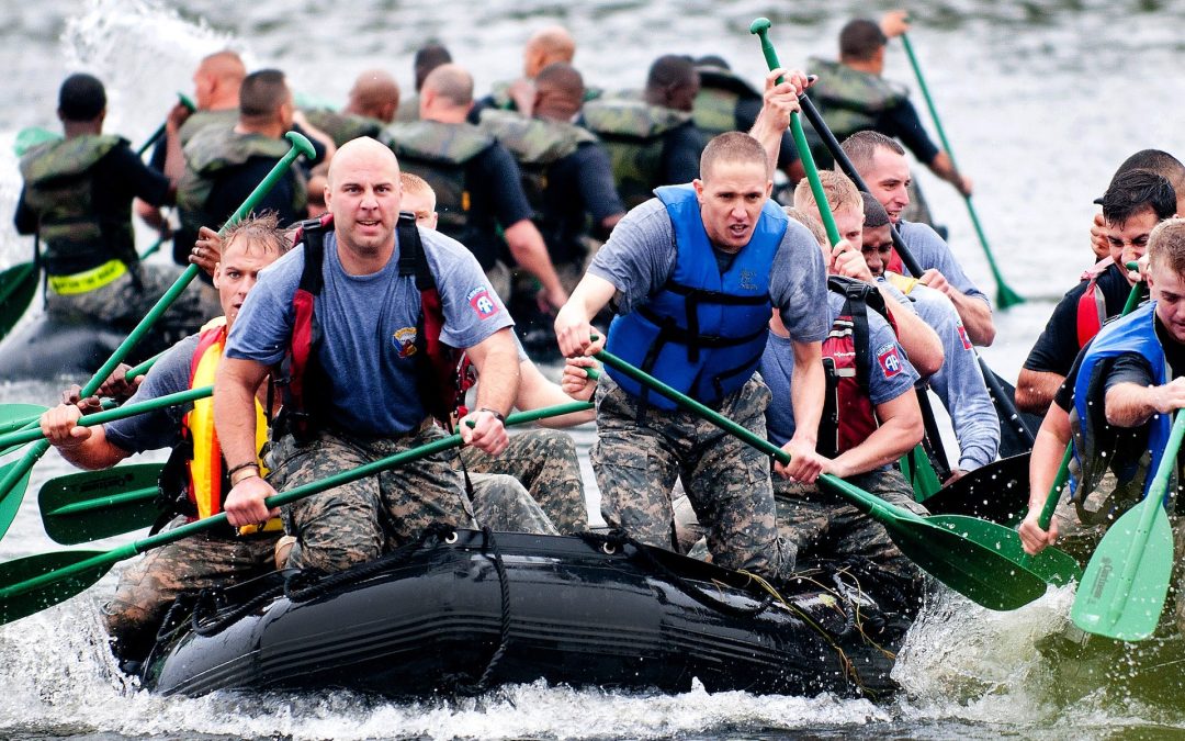 army men rowing value of teamwork in the military